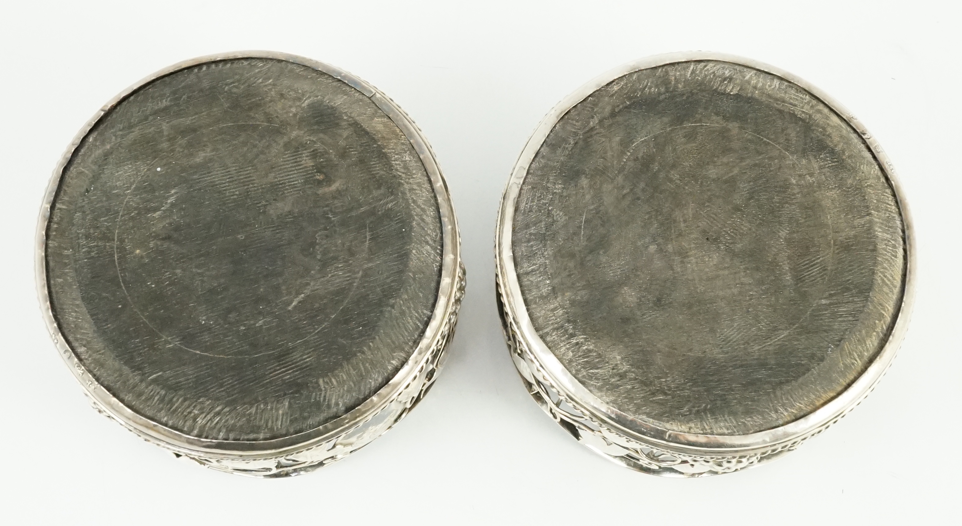 A pair of George III silver mounted wine coasters, by William Plummer